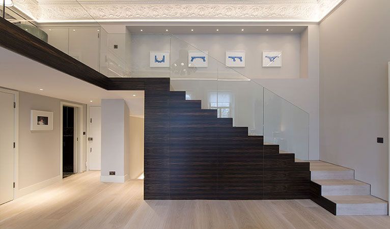 Macassar high quality wood staircase, low-iron toughened glass balustrade in Kensington apartment