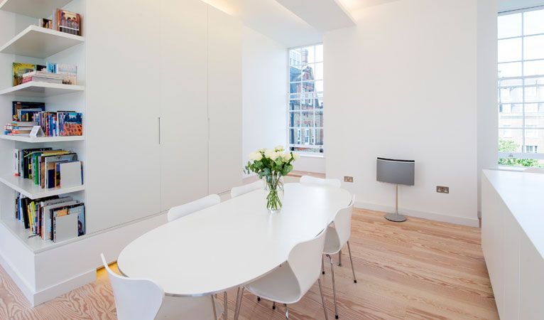 Bespoke joinery unit & dining area with corner shelving/storage in Covent Garden WC2