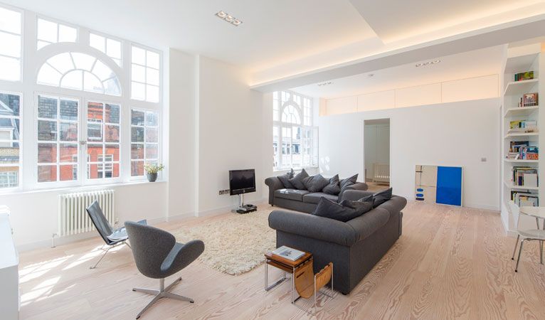 Open plan lounge natural lighting cast iron old school radiators Covent Garden