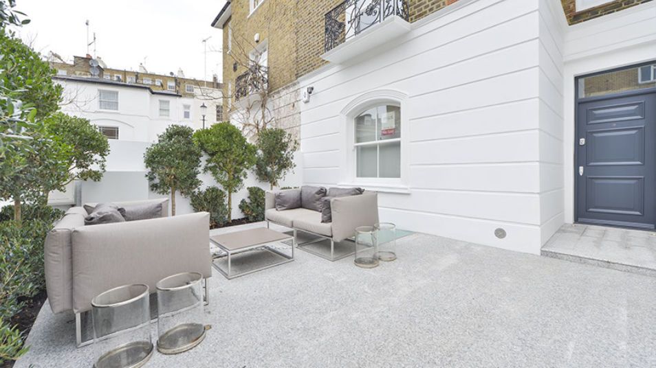 Granite Courtyard in Chelsea SW7 with seating area & glazed patio roof light