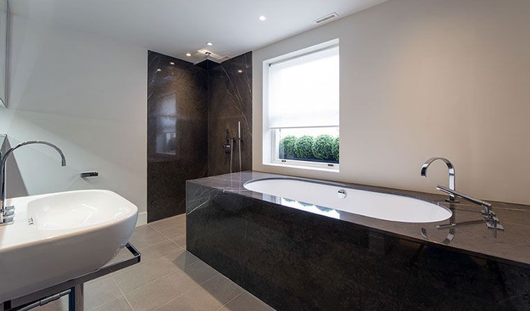 En-suite Marble Bathroom with bath & separate shower in Kensington apartment SW7
